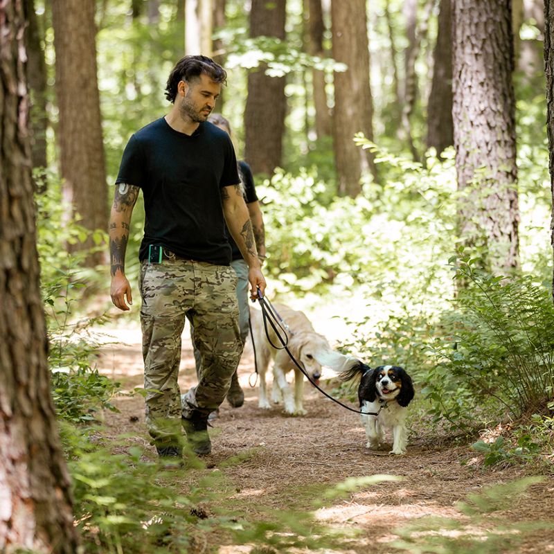 Wilde American owner Carter Wilde walks happy dog in forest with the 5.5 Flat Leash
